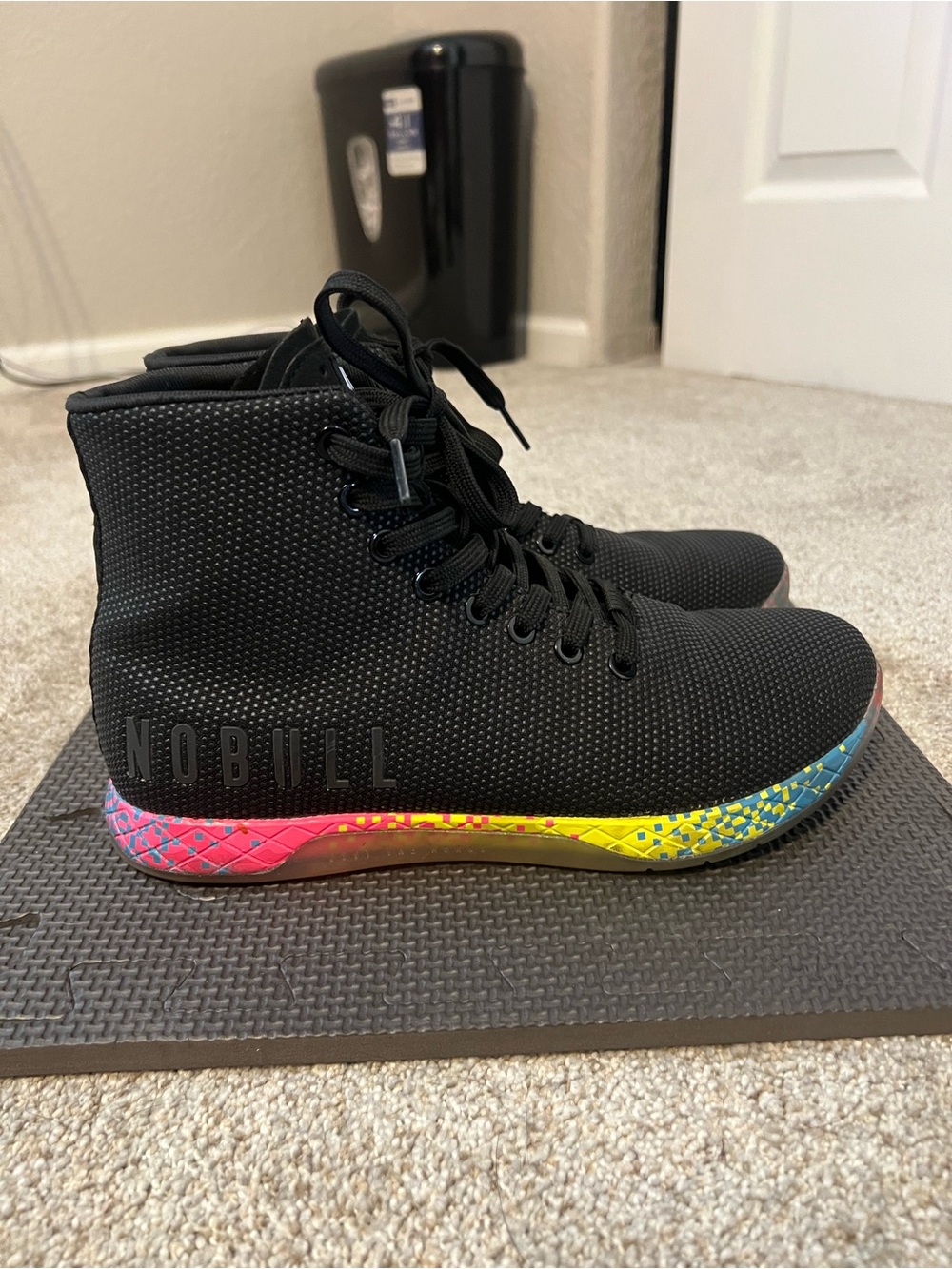NOBULL Black High-Top Tasiners with Multicolor Rainbow Midsole